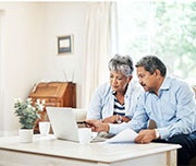 man and women looking at a computer